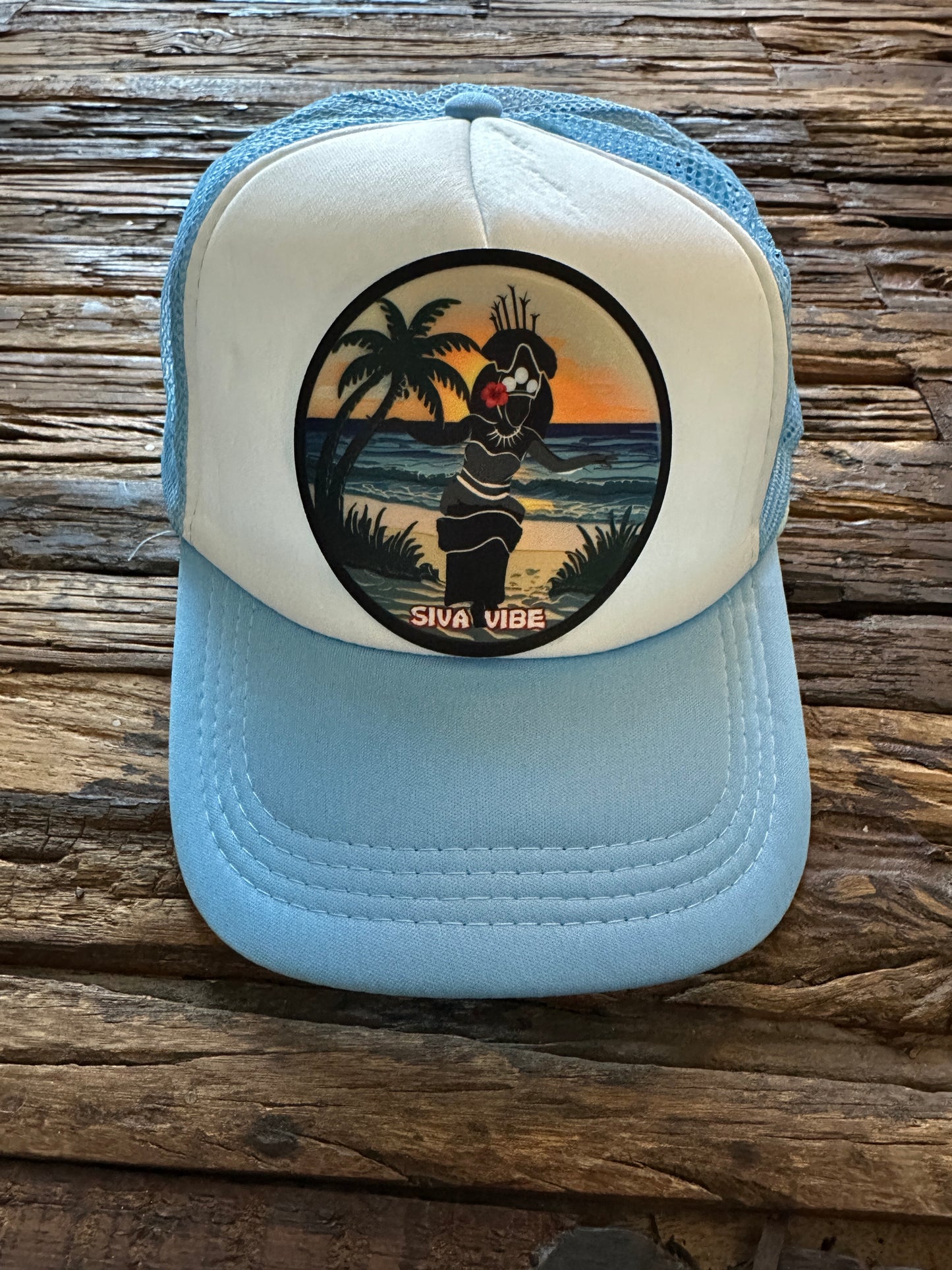 Taupou patch foam hat by Siva Vibe with white front and baby blue mesh — Polynesian-inspired embroidered headwear