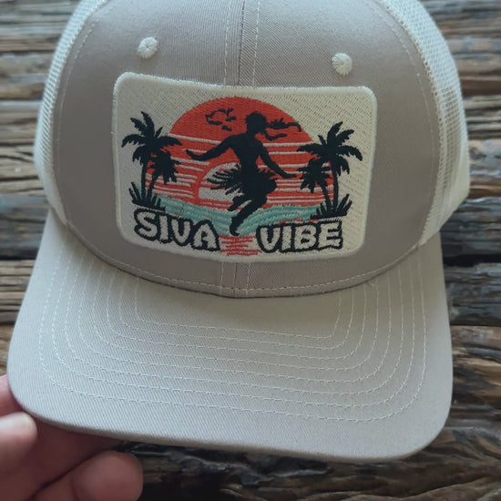 Video of Siva Vibe gray trucker hat spinning to show full view — embroidered island logo and breathable mesh construction