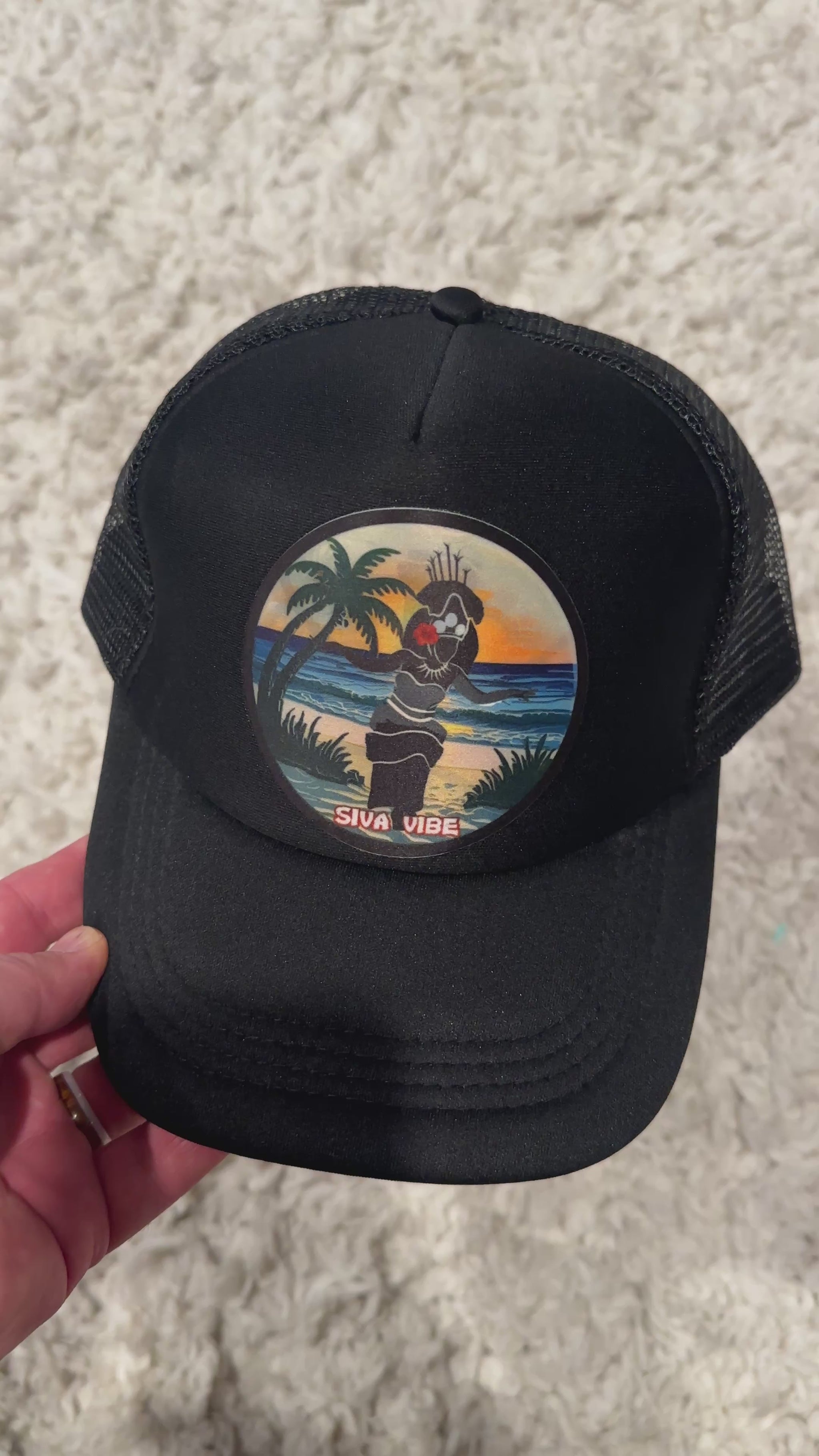 Video of all black Samoan Taupou patch trucker hat by Siva Vibe — showcasing cultural design and breathable foam mesh style