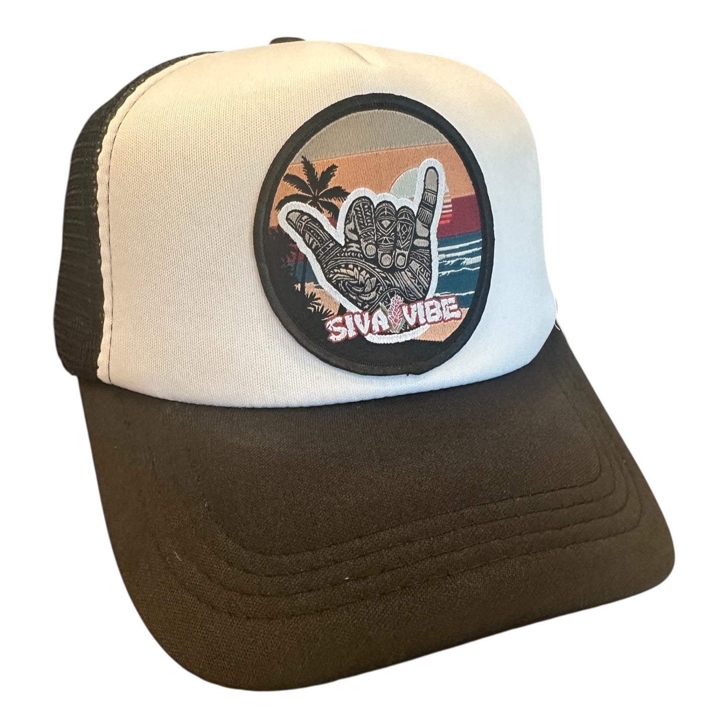 Two-tone Shaka foam trucker hat by Siva Vibe with white front panel and black bill, blending island vibes with a bold look