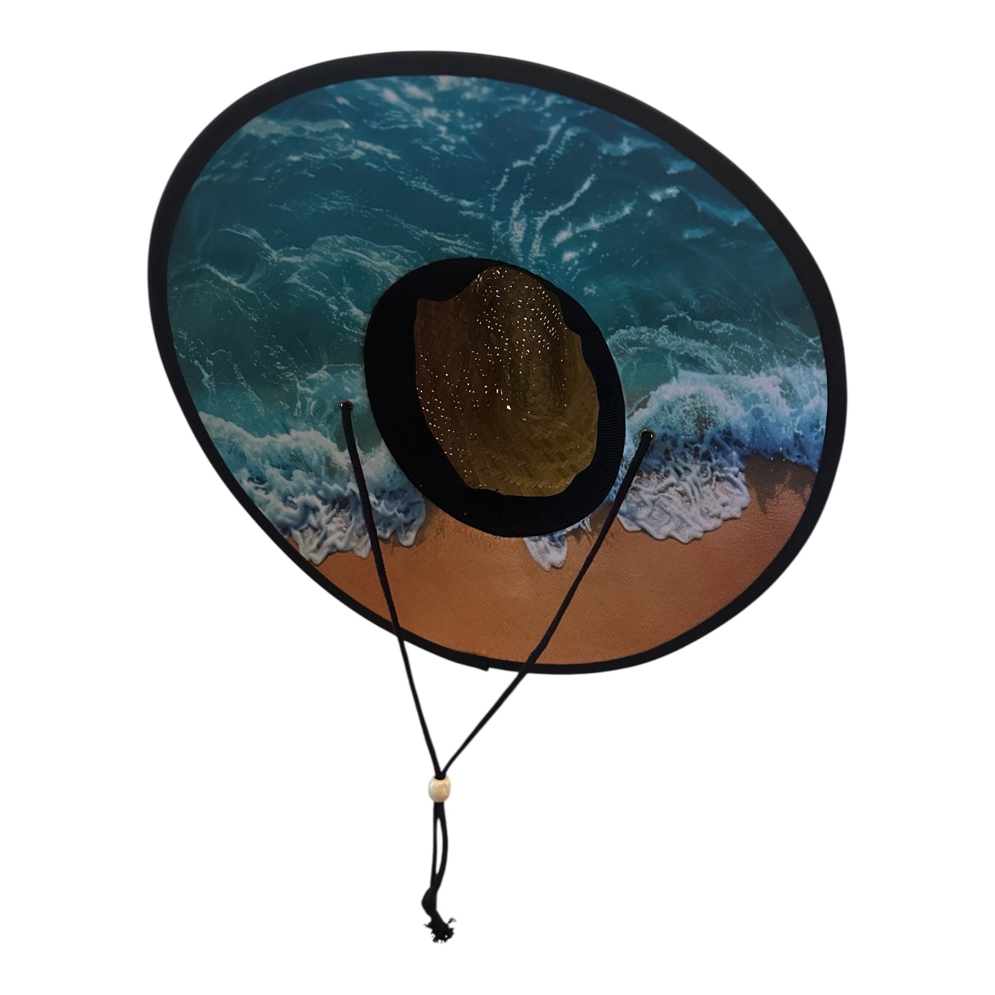 Close-up of Siva Vibe straw lifeguard hat’s underbrim featuring vibrant beach and wave print design