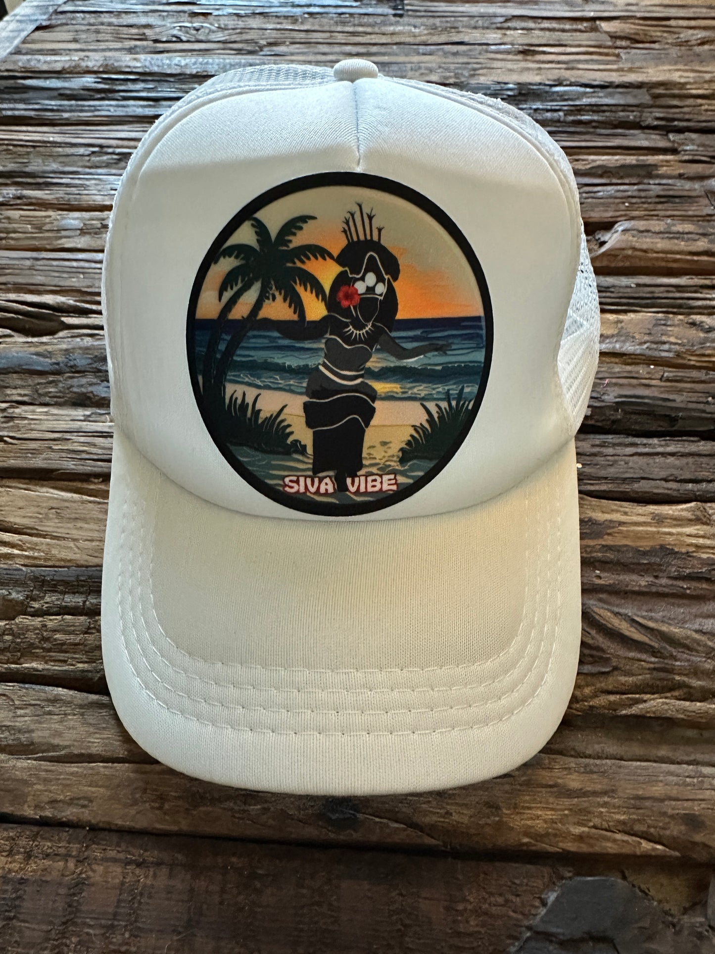 All-white Samoan Taupou patch trucker hat by Siva Vibe — breathable foam mesh with cultural embroidered design